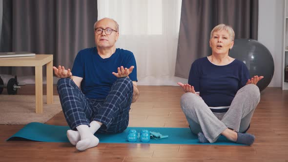 Old Couple Doing Breathing Exercise alt