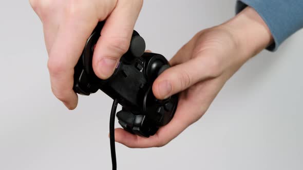 Hand holding joystick and play on white background. 4k alt