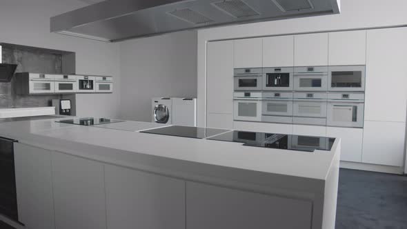 Interior Showing Modern Kitchen with Different Appliances in Luxury Showroom alt