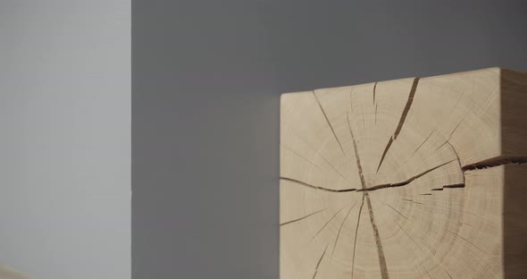 Square Piece of Wood in an Interiorin Minimalist Living Room with Gray Tone alt