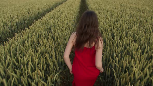 Young Woman Running Across the Field