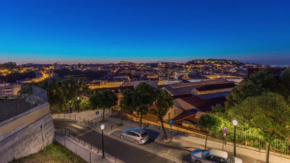 Lisbon aerial cityscape skyline night to day timelapse from viewpoint of St. Peter of Alcantara alt