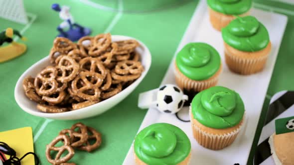 Kids football party set with snacks and drinks. alt