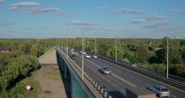 Cars Traffic Over the Bridge Across the River