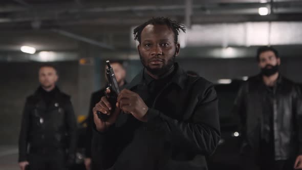 African American Criminal Loading Gun alt