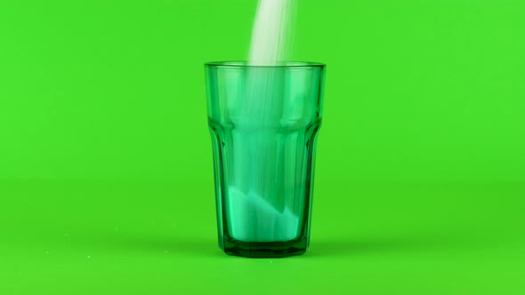 Pour Sugar Green Collins Glass Thick Bottom Green Contrasting Background Concept alt