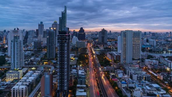 Bangkok traffic on Taksin bridge over Chao Phraya river during rush hour in  morning - time lapse