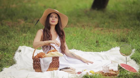 Serene Young Attractive Woman Having a Picnic