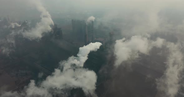 Top View of the Metallurgical Plant. Smoke Coming Out of Factory Pipes. Ecology alt