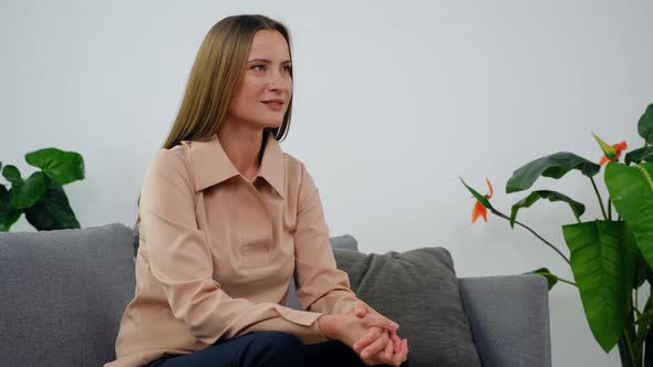 Smiling Adult Woman with Mental Health Problem Talking to Psychologist in Clinic alt