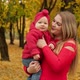 Young Mother and Child in Autumn Park - VideoHive Item for Sale