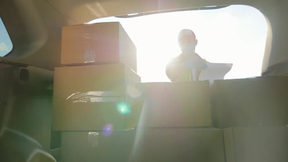 Young Delivery Man Checking List alt