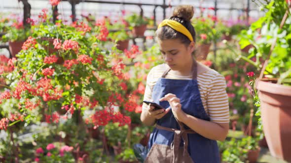 Florist Shoots Video with Smartphone Walking Past Flowers