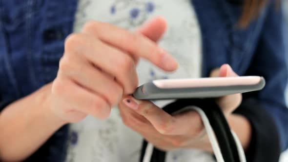 Woman holding many shopping bags and using smart phone  alt