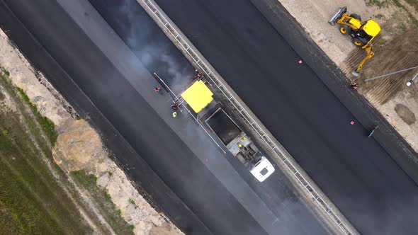 Rise over highway with road equipment. Maintenance of transport infrastructure alt