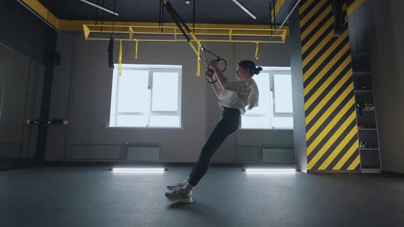 Fitness Woman Workout Exercise with Trx Equipment in the Fitness Gym Healthy Lifestyle Building alt