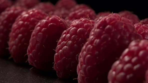 Close-up of rows of ripe raspberries