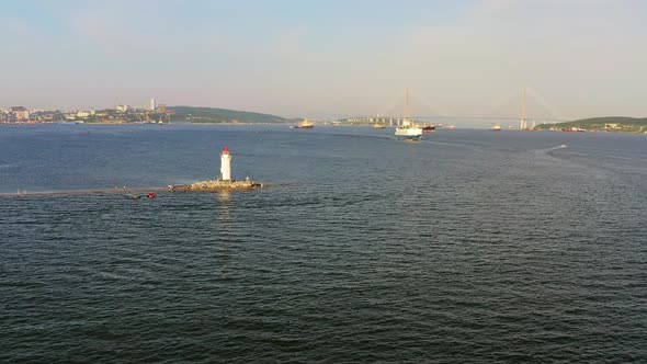 Tokarevsky Lighthouse with Tourists Sunny Bosphorus East and Russian Bridge alt
