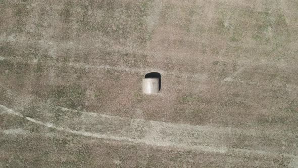 Many bales of hay on the field alt