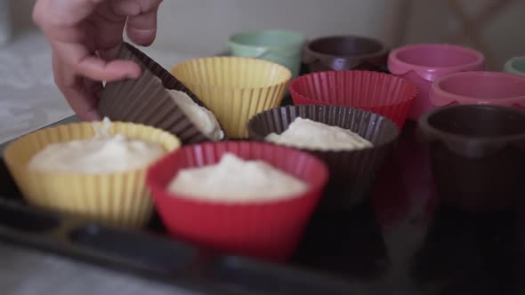Woman Cooks Cupcakes in the Kitchen
