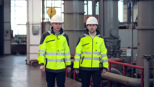Two Engineers at an Industrial Plant alt