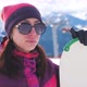 A Young Woman on a Snowboard on Top Mountain on a Ski Track - VideoHive Item for Sale