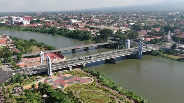 Modern Brawijaya bridge over Brantas river in Kediri, Java, Indonesia, aerial alt