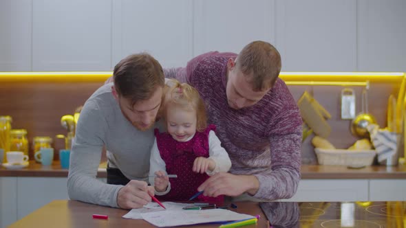Cute Little Kid with Gay Parents Drawing Indoors alt