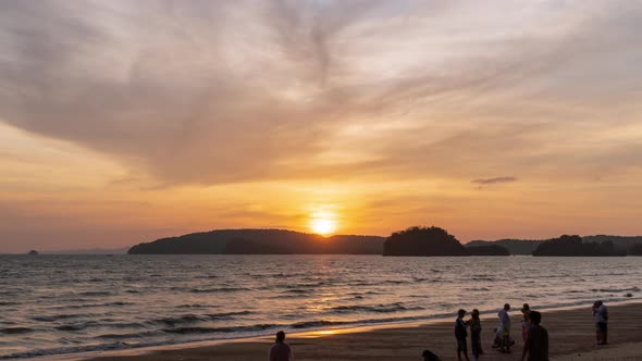 Sunset over Andaman sea at  Noppharat Thara beach, Krabi, Thailand; day to night - Time Lapse