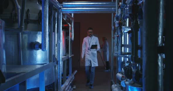 Scientist Checking Lab Equipment alt