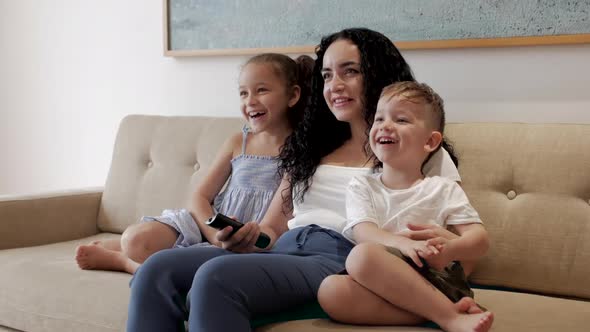 Happy Family, Mom and Cute Little Children Watch the TV, Mom Plays with Children at Home, Relaxing alt