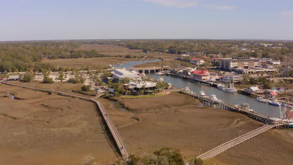 Aerial view of Shem Creek Boardwalk and its surrounds alt