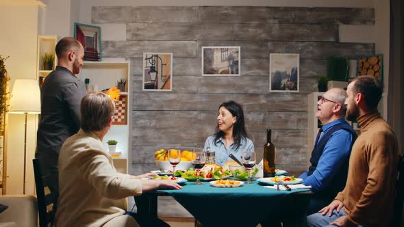 Beautiful Young Woman Blowing Candles on Birthday Cake alt