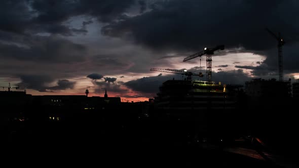 Time Lapse Crane Moving on Construction Site at Sunset in Vienna Austria