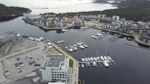 Aerial looking down at piren and sjosanden at Marna river mouth in Mandal - Calm evening aerial Norw alt
