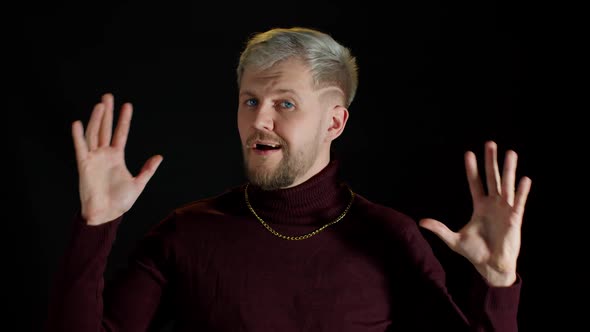 Man in Stylish Blouse Looking at Camera Through Hands Posing Feeling Happiness Fun Enjoyment alt