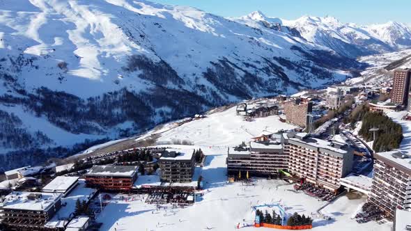 Aerial View of the Alps Mountains in France. Mountain Tops Covered in Snow. Alpine Ski Facilities