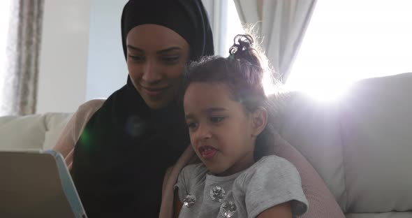 Mother and daughter at home alt