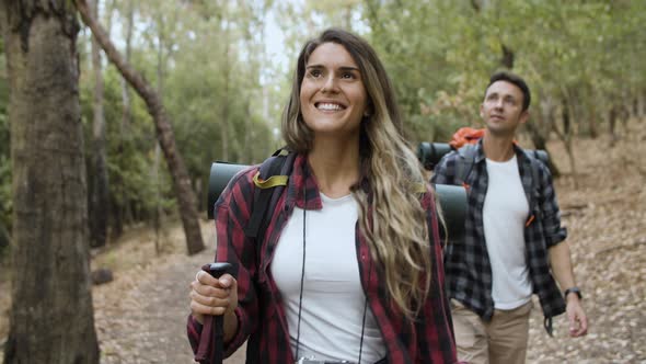 Couple of Happy Hikers Looking Around alt
