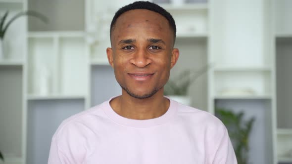Confident Smiling Young African Businessman Looking at Camera in Office alt