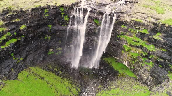 Aerial view above of breathtaking Fossa waterfall, Faroe Island. alt