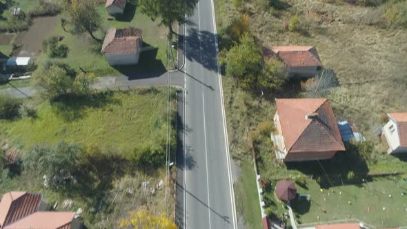 Top View of Small Houses with Green Yards in Small Village in the Mountains alt