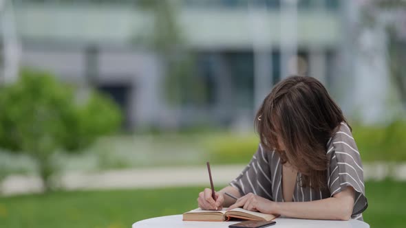 Selfeducation and University for Adult People Middleaged Woman is Reading Book alt