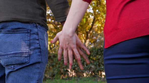 black man and white woman hands holding.mixed,interracial love concept alt