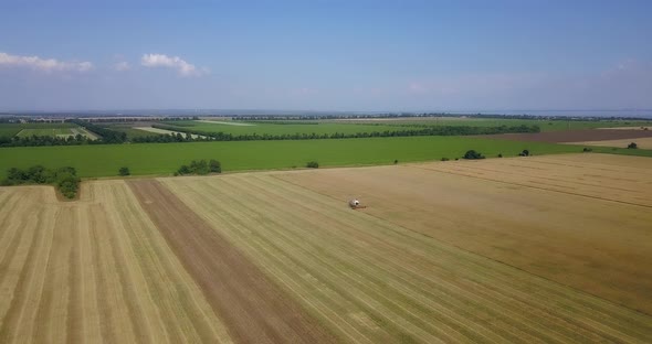 Flight Over Large Fields With A Working Combine