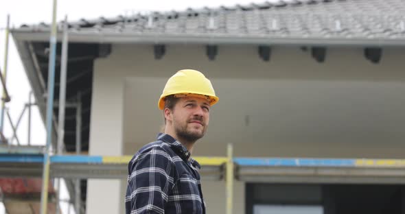 Construction worker looking around on construction site