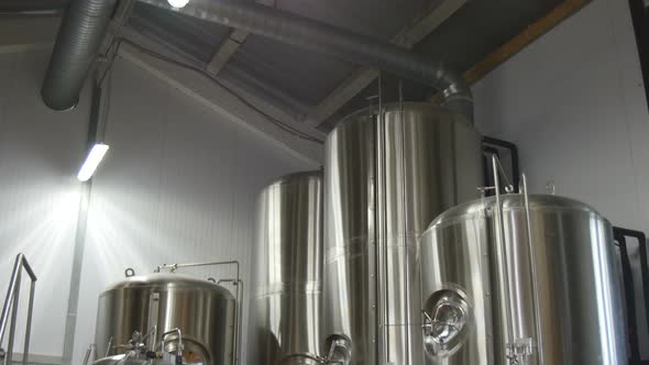 Beer Production In The Factory. Beer Is Cooled In Tanks.