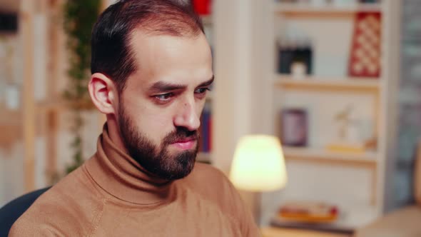 Focused Engineer Working on a Big Turbine Project alt