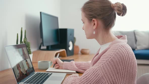 Woman Talks on Online Group Video Call Conference of Work Team From Home Office