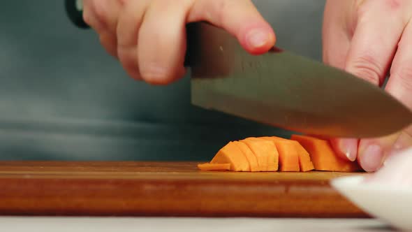 Woman Hands Slice Carrot